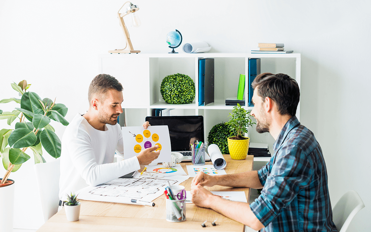 A couple of men sitting at a table